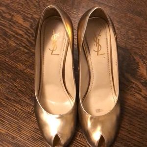 Gold peep- toe YSL heels.
